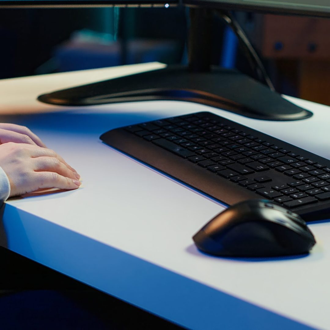 Teleworking computer technician typing on keyboard, implementing security measures to protect company systems and data, close up. Remote IT employee at home debugging code for software, camera A